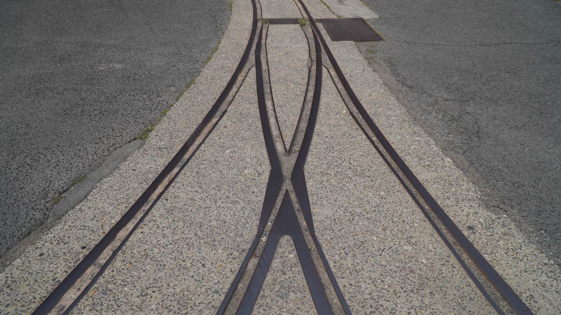 Steel rail tracks embedded in pavement, representative of the Waterloo LRT DC stray current mitigation project