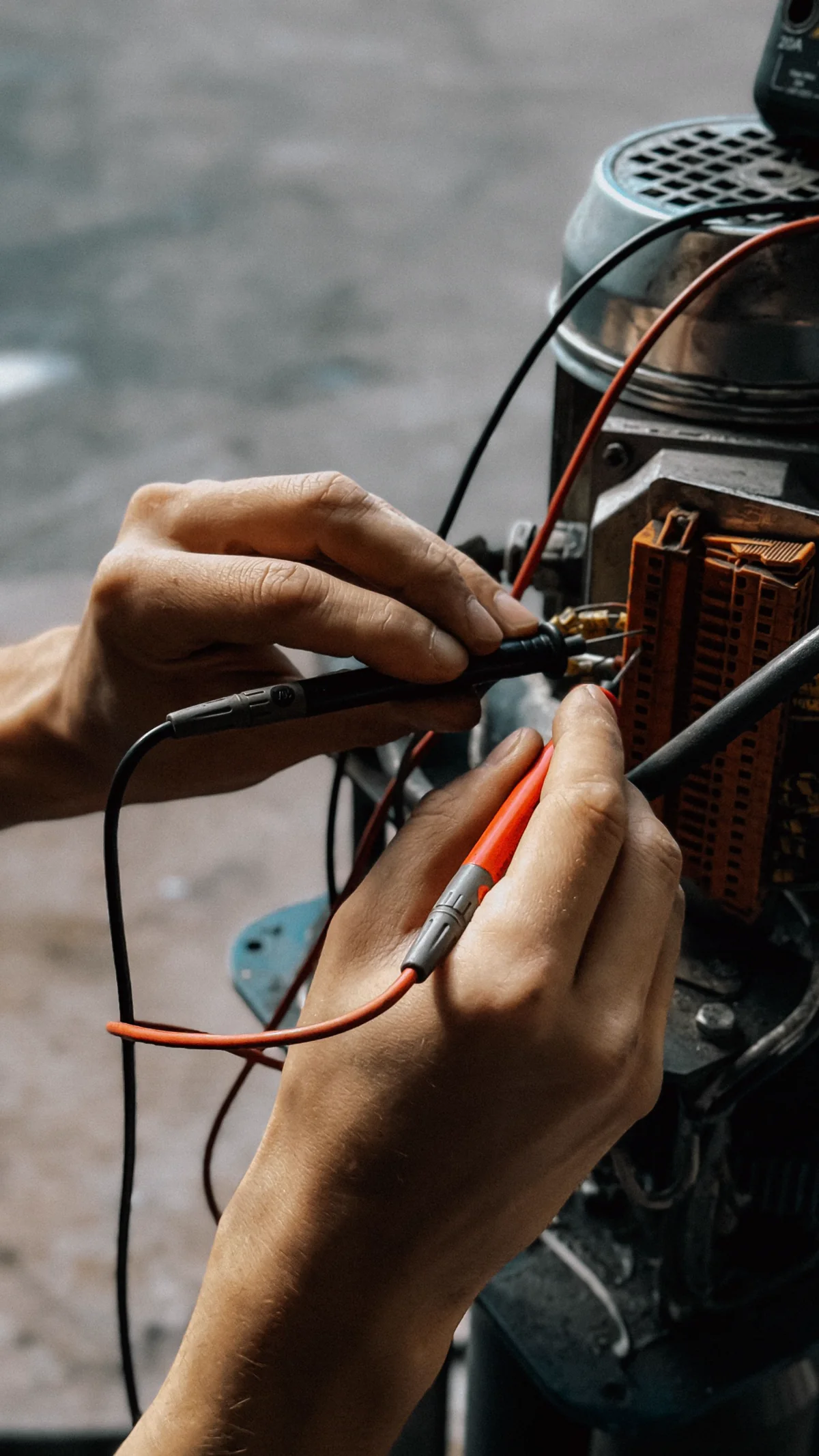 Close-up of a multimeter testing electrical wires